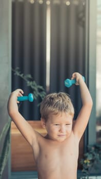 Portrait of a boy doing exercises. Self isolation at home