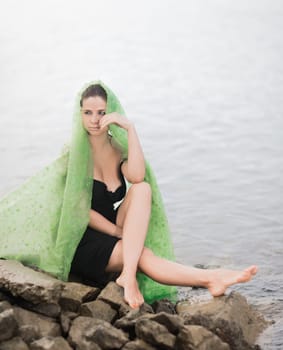 Portrait of a beautiful sexy woman outdoor. Model near the sea