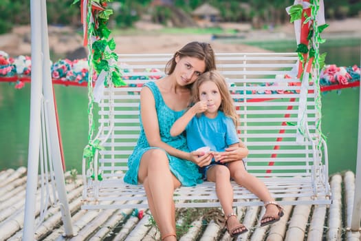 Outdoor portrait of a beautiful happy family. Mother and daughter together