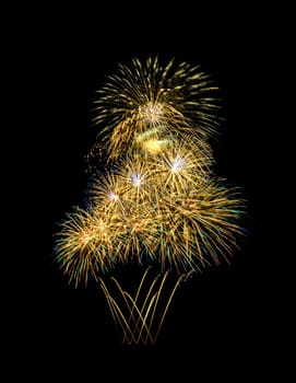 Beautiful colorful fireworks exploding in the night sky, isolated on black background. New year and anniversary concept.