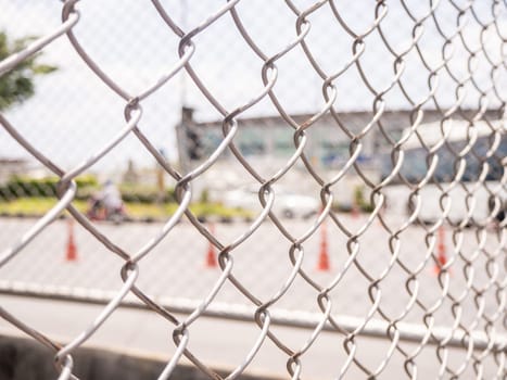 Wire fencing beside each other, the line between the road