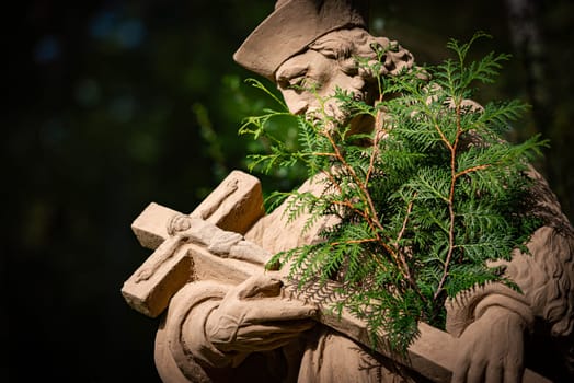 Statue of priest in city park of Bad Mergentheim. Bavaria, Germany, Europe.