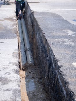 installing concrete drains on the side of the road