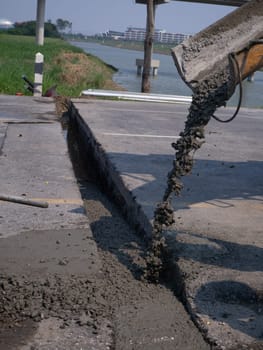 The Builders pouring cement during Upgrade to residential street.
