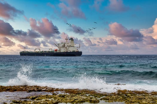 Tanker Beyond Crashing Surf on Curacao