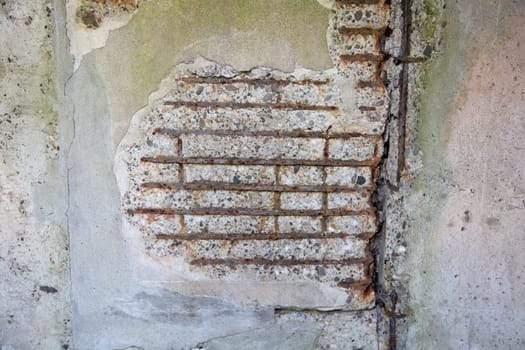 Detail of a broken reinforced concrete wall..
