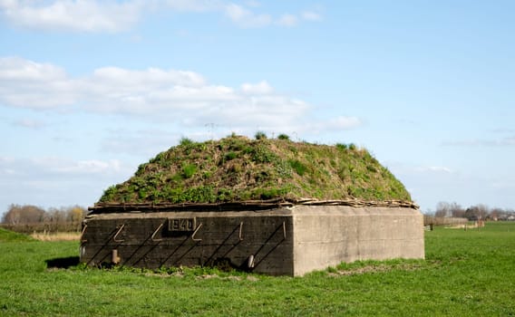 Defensive military fortification in a meadow..