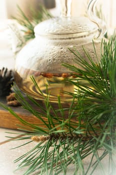medicinal herbal decoction with pine buds, vertical image