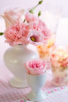 Beautiful bouquet in pink and white in vase on the kitchen table