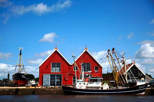 Zoutkamp, Groningen, The Netherlands - July 3 2019, Fishing boats moored at the harbor of Zoutkamp in Groningen, the Netherlands..