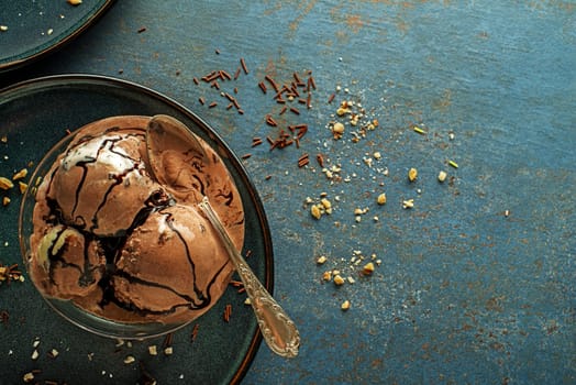 Set of ice cream scoops with chocolate flavours. Chocolate syrup topping on ice cream