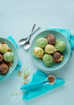 Set of soft ice cream scoops or frozen yogurt of different flavours with chocolate, nuts and fruits