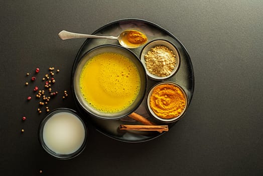 Healthy drink with curcuma and milk. Golden Milk, made with turmeric and other spices
