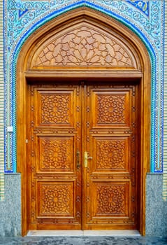 Ornate wooden door on Iranian Mosque in Bur Dubai