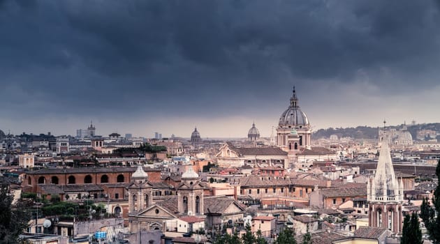 View of Rome skyline under stormy skies from Terrazza del Pincio