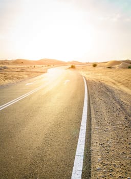 Empty highway through desert near Al Ain in UAE.