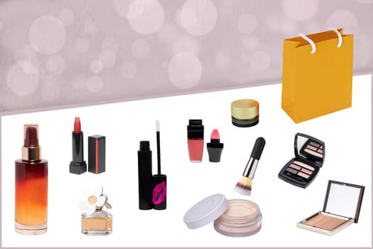 Decorative composition of feminine beauty products. Set of make up brushes, liquid make-up pillow, skin care products, eye shadows powder, serum for face, perfume bottle, a bag and other beauty accessories on a white table over abstract background. Space for your design.
