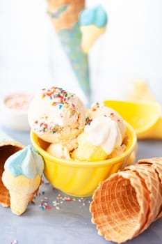 Scoops of vanilla ice cream with rainbow sprinkles