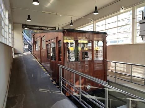 Stuttgart, Germny - November 10, 2019: Ancient brown funicular cable car in the lower station in the forest of stuttgart heslach waiting for tourists to drive up to Waldfriedhof station