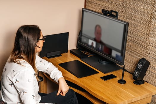 Businesswoman working on graphic tablet and computer from comfort of her home during covid 19 or coronavirus pandemics, lockdown and quarantine