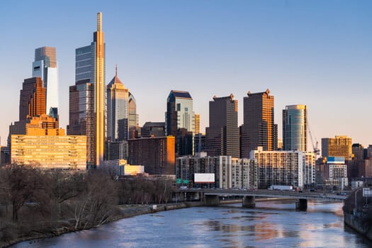 Cityscape of Philadelphia skyscraper Skylines building sunset along river in Philly city downtown of Philadelphia in PA USA. Cityscape Urban lifstyle concept.