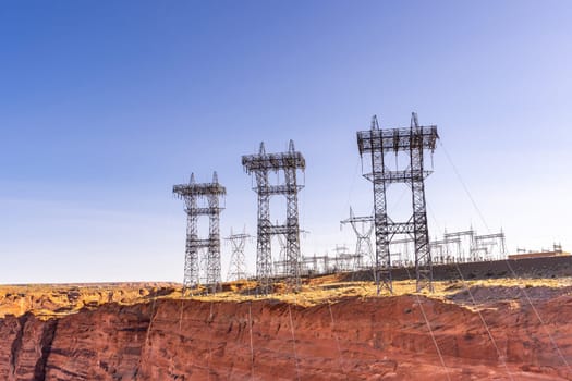 Power plant house and power line over Electricity generating dam in Page Arizona USA