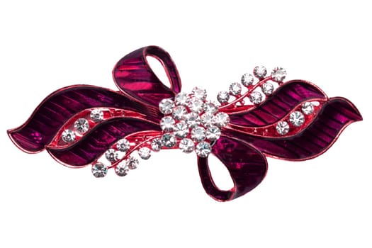 Close-up of a beautiful elegant luxurious hair clip or hair pin with rhinestones isolated on a white background. Macro photograph.