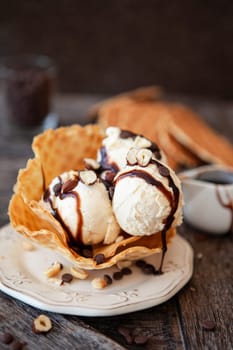 Scoops of vanilla ice cream in a waffle cup