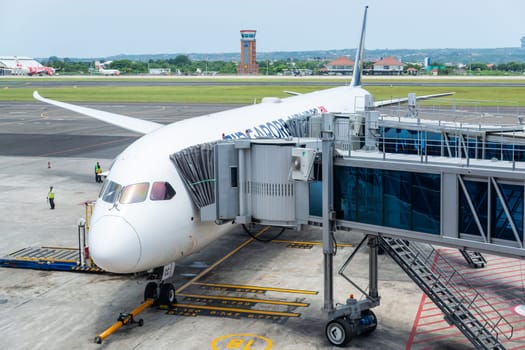 DENPASAR, INDONESIA - CIRCA MARCH 2019: A Singapore Airlines Boeing 787 Dreamliner at Denpasar International Airport also known as Ngurah Rai International Airport, in Bali.