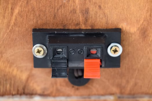 The back of the speakers. Terminals for attaching speaker wires to the speaker. Column speaker 15AS-208. Vintage Soviet bookshelf acoustics.