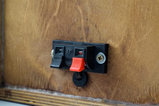 The back of the speakers. Terminals for attaching speaker wires to the speaker. Column speaker 15AS-208. Vintage Soviet bookshelf acoustics.
