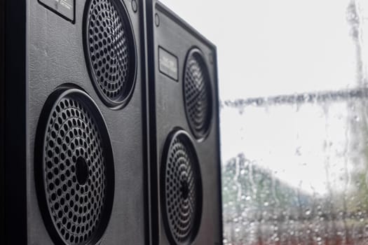 Krasnodar, Russia - April 11, 2020: Vintage speakers by the window. Column speaker 15AS-208. Vintage Soviet bookshelf acoustics.