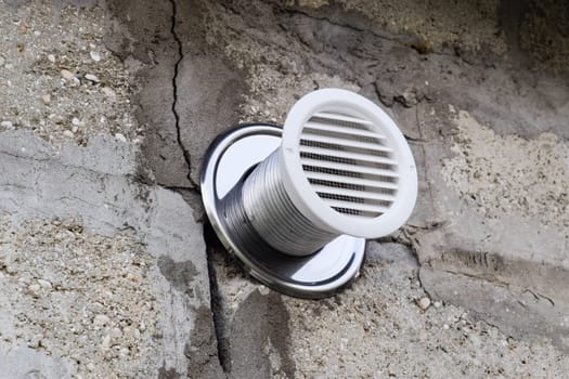 Air vent in the wall from the sauna. Ventilation grill