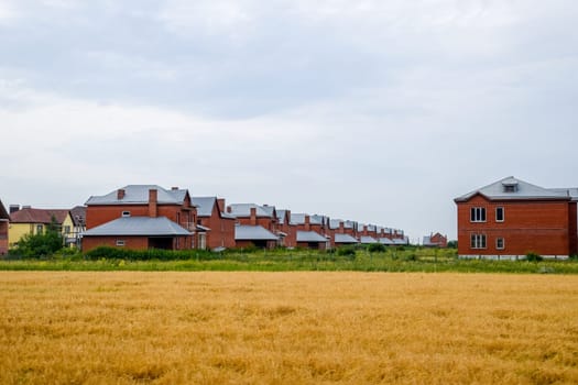 A cottage village of two-storey houses. Low-rise development.