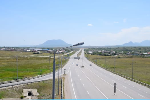 The road crossing is adjacent to the secondary road.