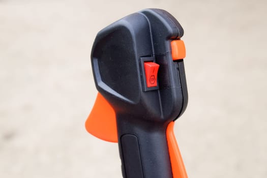 Knob with trimmer controls. Gas trimmer, equipment controls. Trimer gascosis with a leaf for mowing grass and shrubs.
