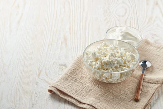 Fresh village cottage cheese and yogurt in glass bowsl. Healthy food. Dietary product. Dairy product. Fitness food