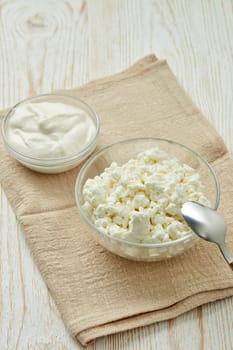 Fresh village cottage cheese and yogurt in glass bowsl. Healthy food. Dietary product. Dairy product. Fitness food