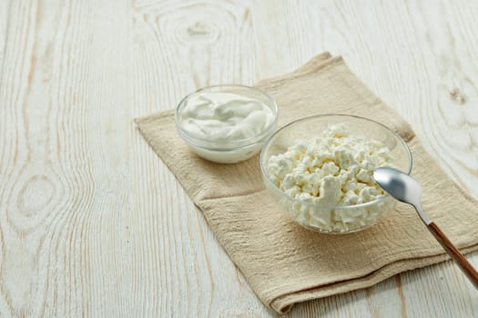 Fresh village cottage cheese and yogurt in glass bowsl. Healthy food. Dietary product. Dairy product. Fitness food