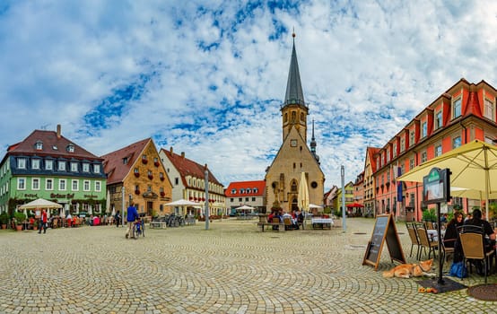 Weikersheim, Germany - September 24, 2014: Old square with cathedral in Weikersheim, Bavaria, Germany, Europe.