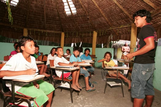 porto seguro, bahia / brazil - june 18, 2010: Pataxo Indians are seen attending an indigenous school in the Jaquira village in the city of Porto Seguro.
