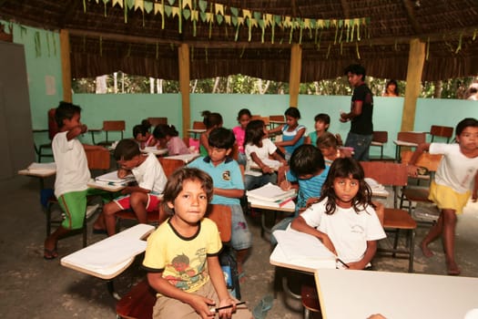 porto seguro, bahia / brazil - june 18, 2010: Pataxo Indians are seen attending an indigenous school in the Jaquira village in the city of Porto Seguro.