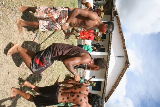 pau brasil , bahia / brazil - april 16, 2012: Pataxo Hahahae indigenous people dance after breaking into a farm in the rural area of Pau Brazil.