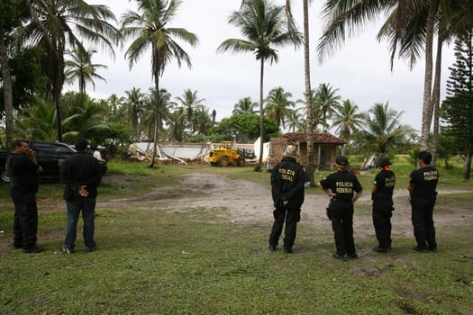 ilheus, bahia / brazil - february 1, 2012: Federal Police officers carry out the reinstatement warrant of the farm occupied by the Tupinamba Indio in Ilheus.