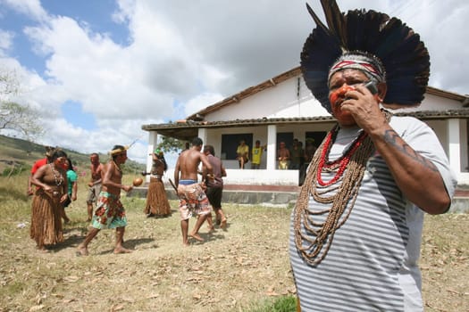 pau brasil , bahia / brazil - april 16, 2012: Pataxo Hahahae indigenous people dance after breaking into a farm in the rural area of Pau Brazil.