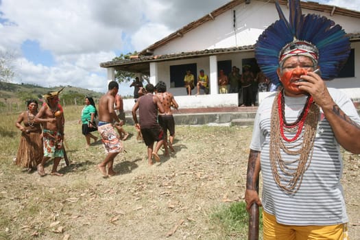 pau brasil , bahia / brazil - april 16, 2012: Pataxo Hahahae indigenous people dance after breaking into a farm in the rural area of Pau Brazil.