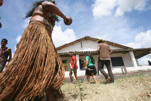 pau brasil , bahia / brazil - april 16, 2012: Pataxo Hahahae indigenous people dance after breaking into a farm in the rural area of Pau Brazil.