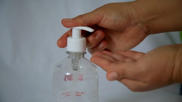 salvador, bahia / brazil - may 6, 2020: person is seen using alcohol gel hand hygiene to protect against Corona Virus.