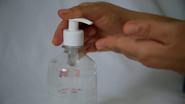 salvador, bahia / brazil - may 6, 2020: person is seen using alcohol gel hand hygiene to protect against Corona Virus.