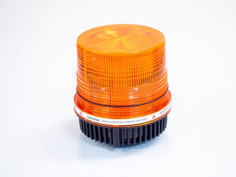 the Orange rotating beacon on white reflective background.